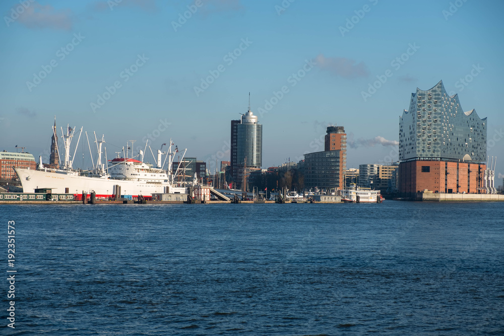 Hamburg, Germany. River station of the city against the backdrop of the river Elbe and port cargo grains