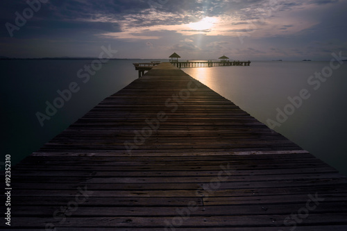 Wooden pier between sunset in Thailand