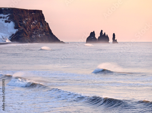 Reynisfjara black sand beach and Reynisdrangar rocks in Iceland at winter photo