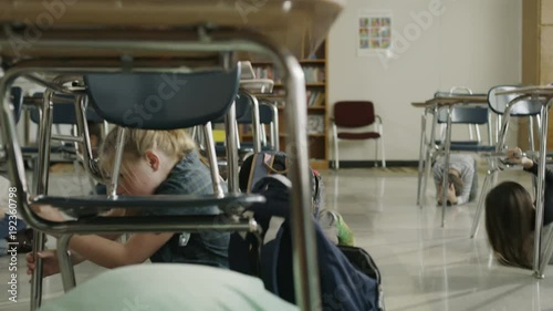 Students in classroom surprised by earthquake hiding under desks / Provo, Utah, United States