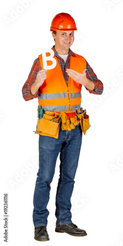 Full length portrait of a male builder in a helmet over white wall background. repair, construction, building, people and maintenance concept.