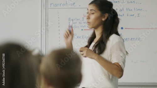 Tracking shot of teacher questioning students in math class / Provo, Utah, United States photo