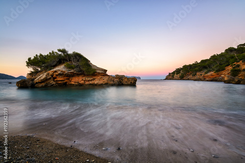 Seascape with island and sea. Long exposure and sunset