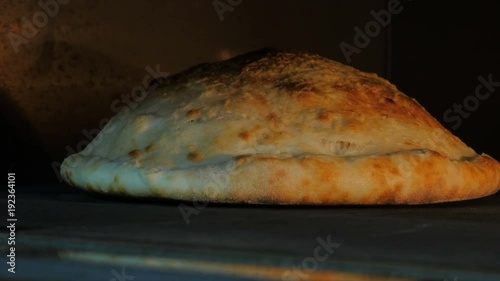 cooking pizza and calzone in a restaurant