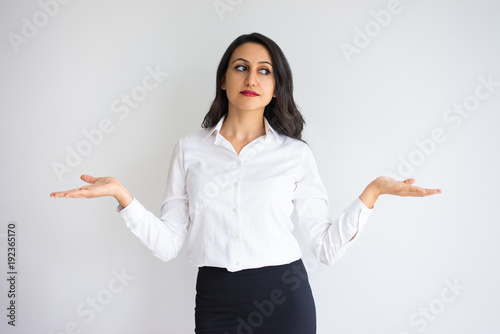Serious Woman Holding Empty Space on Both Palms