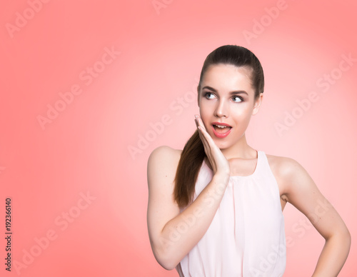 beautiful young woman with long hair posing on background with copy space