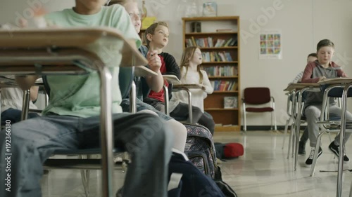 Students in classroom surprised by earthquake drill hiding under desks / Provo, Utah, United States photo