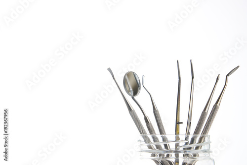 Set of metal dentist s dental medical equipment tools isolated on white background with copy space  close-up