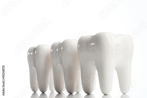 Dental health Concept. White teeth over white background. Oral dental hygiene. Teeth Whitening. Oral Care, teeth restoration. Tooth Implant model, close-up