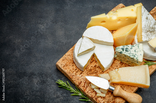 Various types of cheese - parmesan, brie, roquefort, cheddar photo