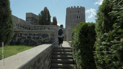 Young girl walks in Rabati Castle - Georgia photo