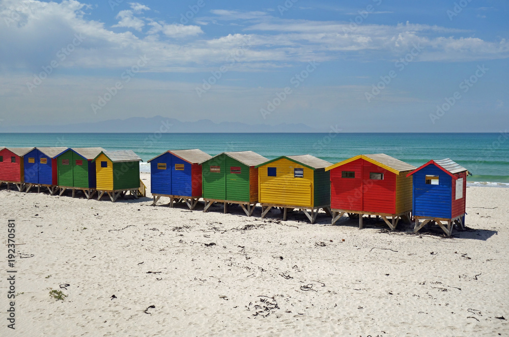 Fototapeta premium View of the brightly colored Victorian beach cabin houses on the Muizenberg Beach in Cape Town