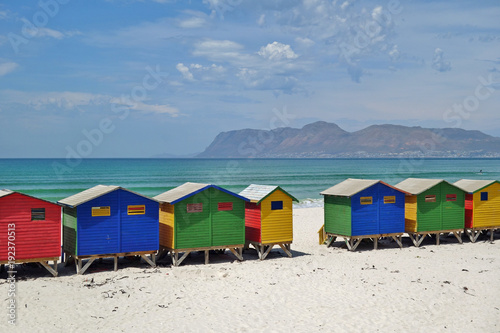 View of the brightly colored Victorian beach cabin houses on the Muizenberg Beach in Cape Town
