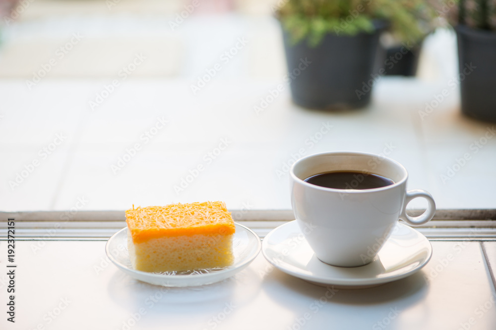 A cup of coffee and golden threads cake A cup of coffee and golden threads cake