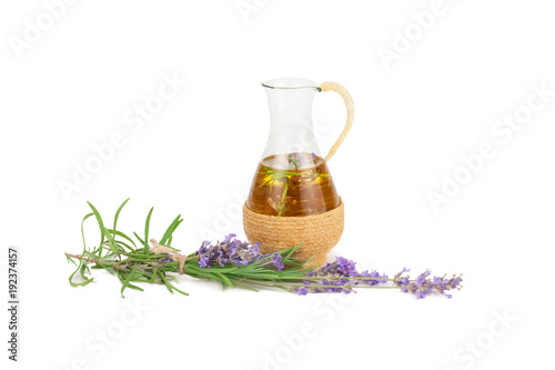 Aromatherapy oil and lavender flowers.