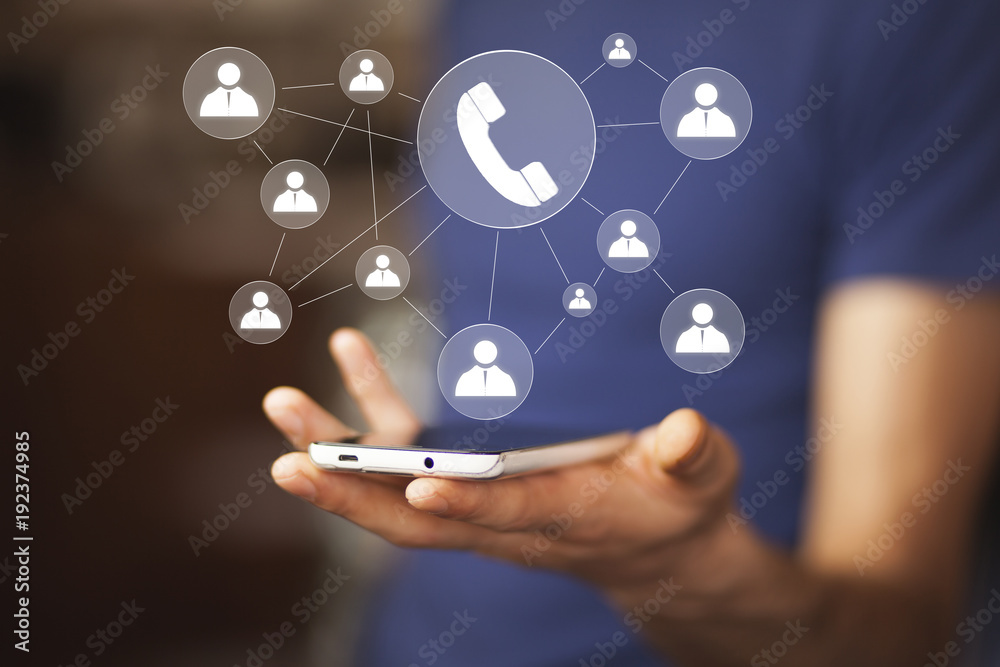 Hand holding smartphone with glowing mobile app icons Hand holding smartphone with glowing mobile app icons