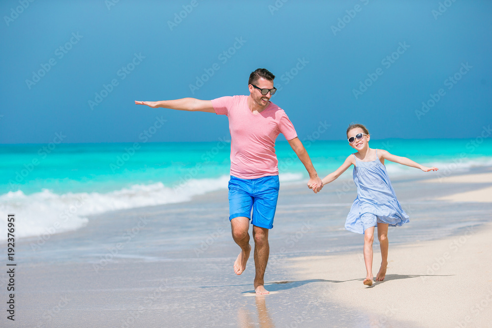 Family fun on white sand beach