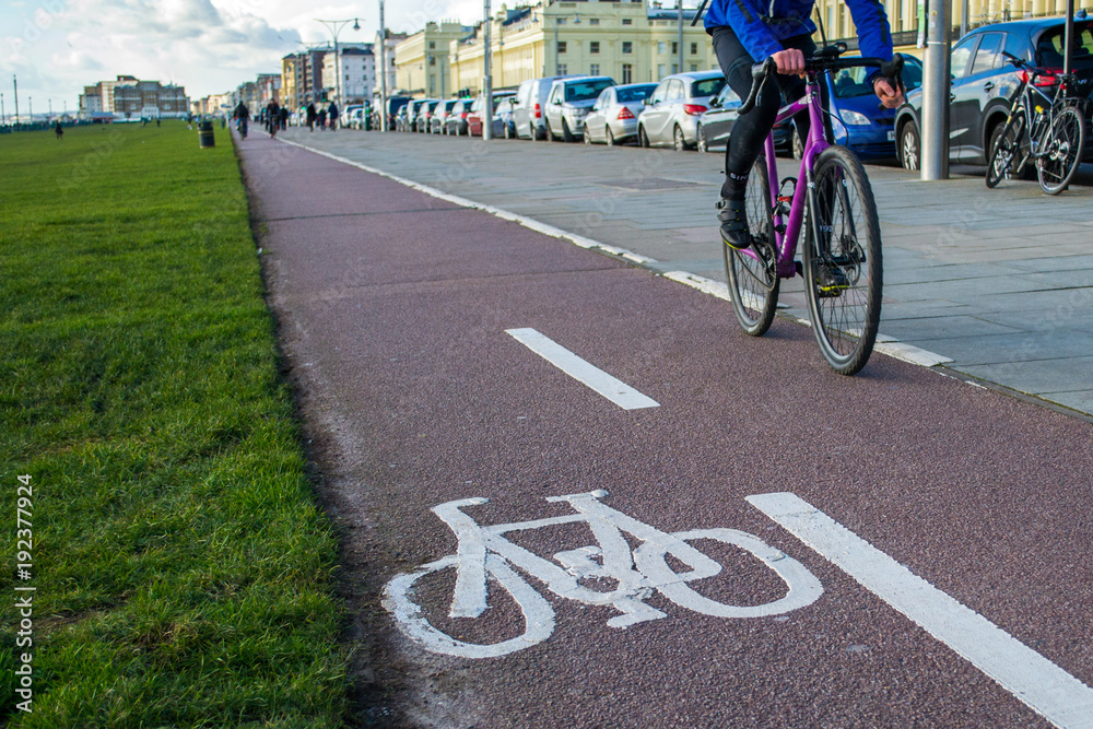 Obraz premium Cycle lane with cyclist riding a bike