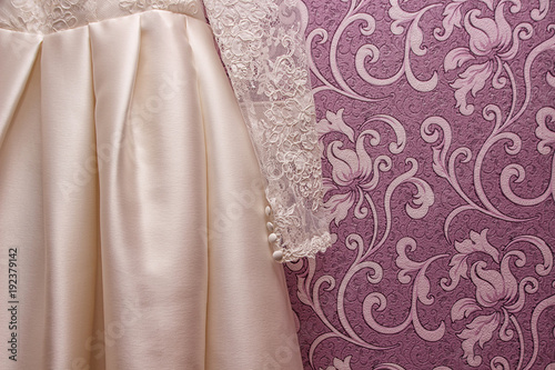 wedding dress of the bride on pink background