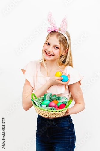 Teenage girl holding Easter eggs