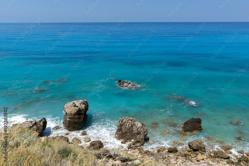 Panoramic view of Agios Nikitas Beach with blue waters, Lefkada, Ionian Islands, Greece Panoramic view of Agios Nikitas Beach with blue waters, Lefkada, Ionian Islands, Greece