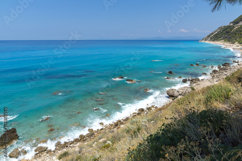 Fototapeta Naklejka Na Ścianę i Meble -  Panoramic view of Agios Nikitas Beach with blue waters, Lefkada, Ionian Islands, Greece