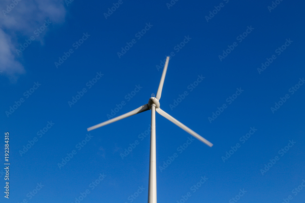 Upper part of a wind turbine against blue sky Upper part of a wind turbine against blue sky