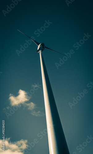 A wind turbine seen from below