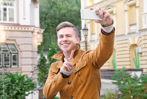 Young handsome man taking s...