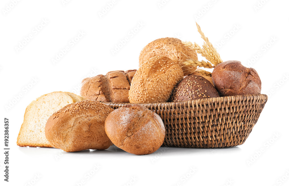 Composition with wicker basket and different bread isolated on white Composition with wicker basket and different bread isolated on white