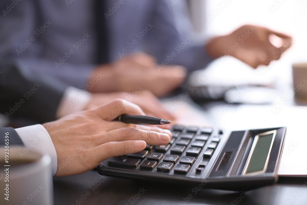 Men working at table in office, closeup. Financial trading concept Men working at table in office, closeup. Financial trading concept