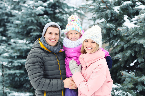 Portrait of happy family in winter park
