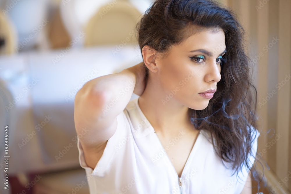 Beautiful young woman relaxing in a coffee shop Beautiful young woman relaxing in a coffee shop