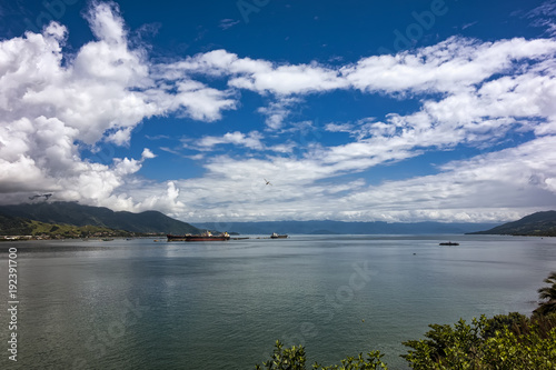 Mid channel between Sao Sebastiao and Ilhabela - São Paulo, Brazil - seen from Ilhabela on a sunny day with sky with clouds