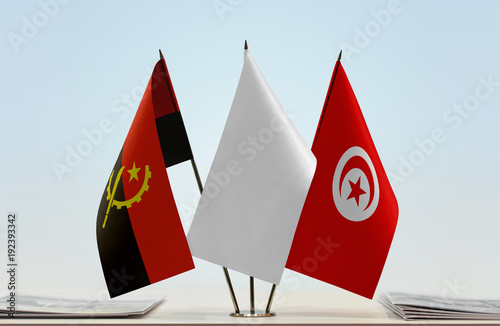 Flags of Angola and Tunisia with a white flag in the middle