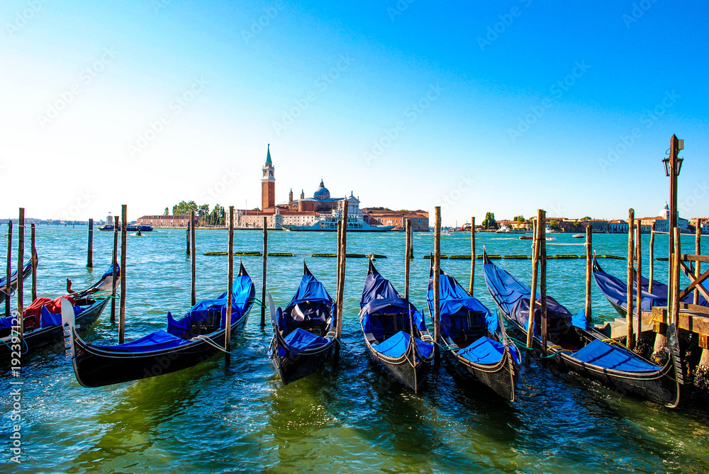 Venetian Gondolas Parked in the Canal in Venice, Italy
