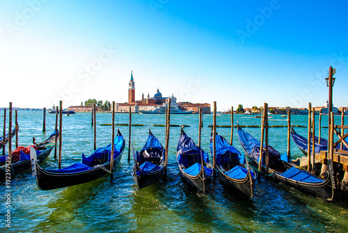 Venetian Gondolas Parked in the Canal in Venice, Italy