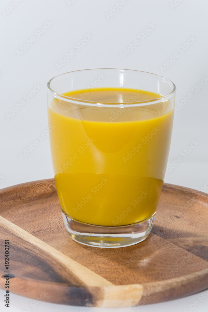 pumpkin juice drink on glass on white background pumpkin juice drink on glass on white background