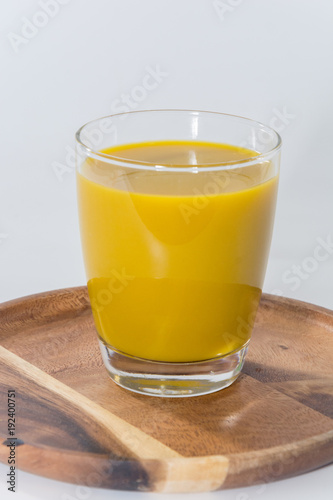 pumpkin juice drink on glass on white background