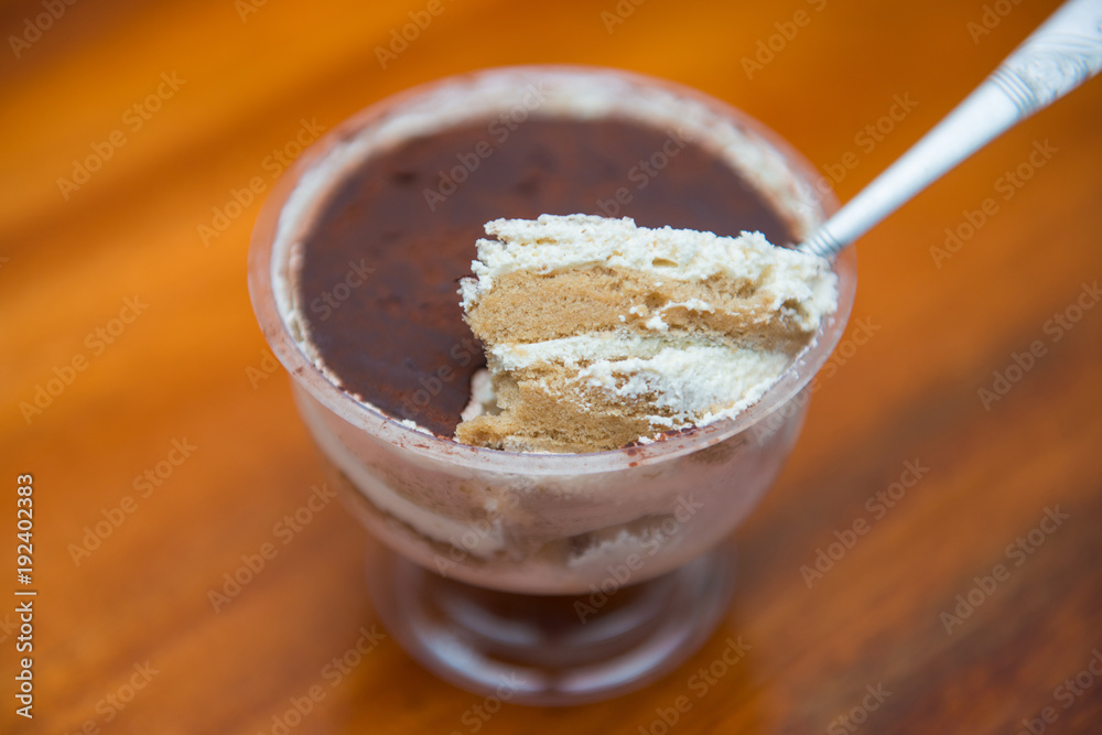 Delicious tiramisu cakes in plastic glass