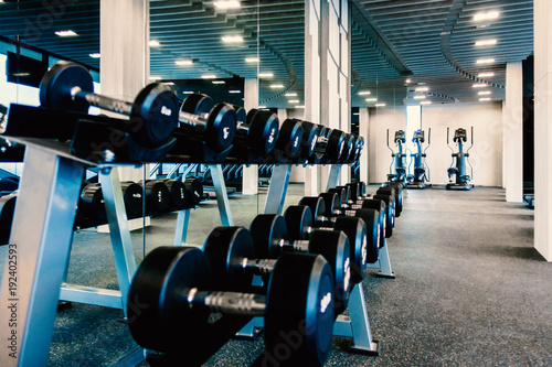 Rack of dummbell in fitness room photo