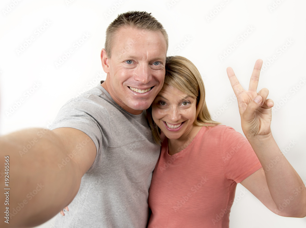 young beautiful happy and attractive romantic couple with husband and wife or girlfriend and boyfriend taking selfie self portrait photo young beautiful happy and attractive romantic couple with husband and wife or girlfriend and boyfriend taking selfie self portrait photo