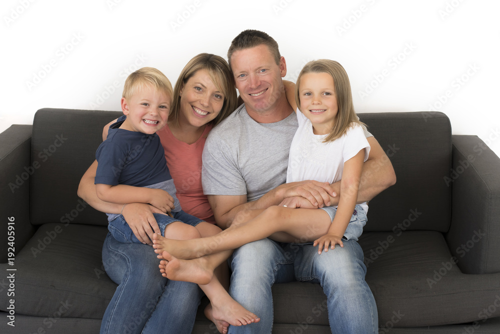 young attractive and happy couple posing sitting at home sofa co young attractive and happy couple posing sitting at home sofa co