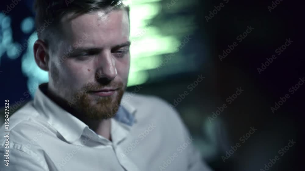 Tracking shot of handsome programmer speaking with colleague while working at night in cyber security center Tracking shot of handsome programmer speaking with colleague while working at night in cyber security center