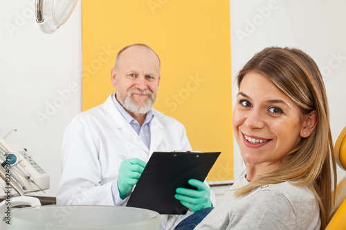 Smiling patient at the dentist office