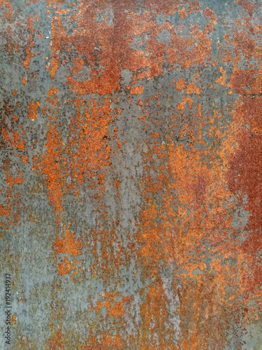 rust on metal surface covered with paint