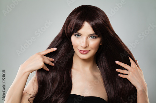 Perfect Woman Touching her Long Healthy Brown Hair, Natural Beauty