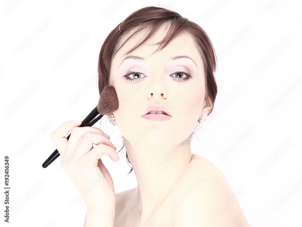 Portrait of a young woman with makeup isolated on white