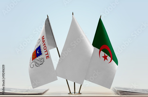 Flags of Mayotte and Algeria with a white flag in the middle