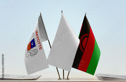 Flags of Mayotte and Malawi with a white flag in the middle